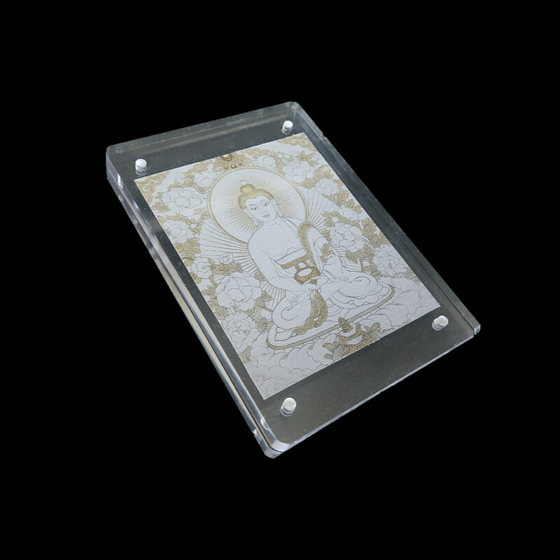 A minimalist Amitabha Buddha Thangka in an acrylic frame, featuring the "White Metal" element colors, set against a solid black background for meditation focus.