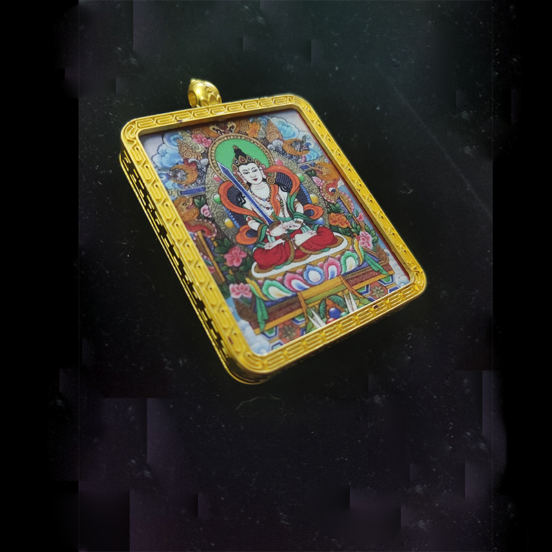 Angled view of an Akasagarbha Bodhisattva pendant in a gold-tone frame, the zodiac guardian for Ox and Tiger, representing boundless wisdom and prosperity