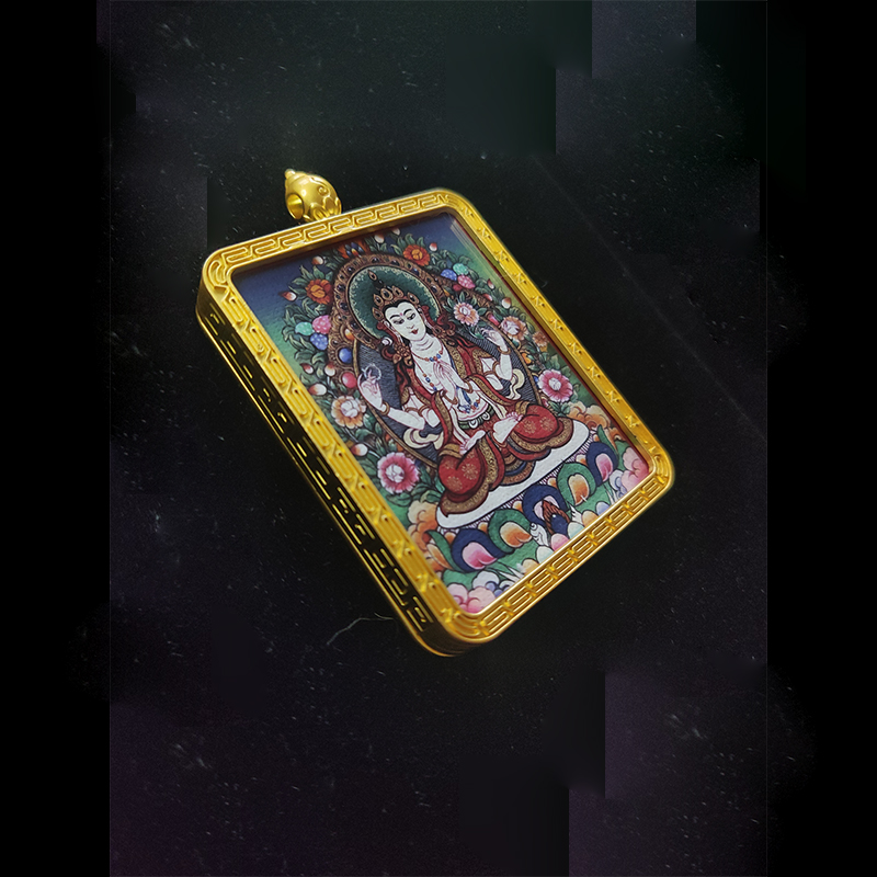 Angled view of a Four-Armed Guanyin (Chenrezig) Buddhist pendant in a gold-tone frame, the zodiac guardian for the Year of the Rat, symbolizing infinite compassion.