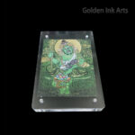 Frontal view of Green Dzambhala (Green Kubera) printed on natural cotton canvas in an acrylic frame, representing the Wood element and successful career growth.