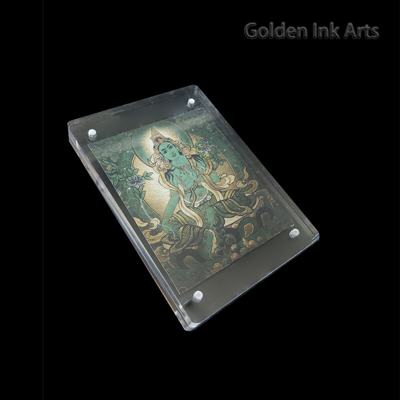 Side angled shot of the Green Tara acrylic frame, highlighting the organic texture of the unbleached cotton canvas and the clear modern casing.