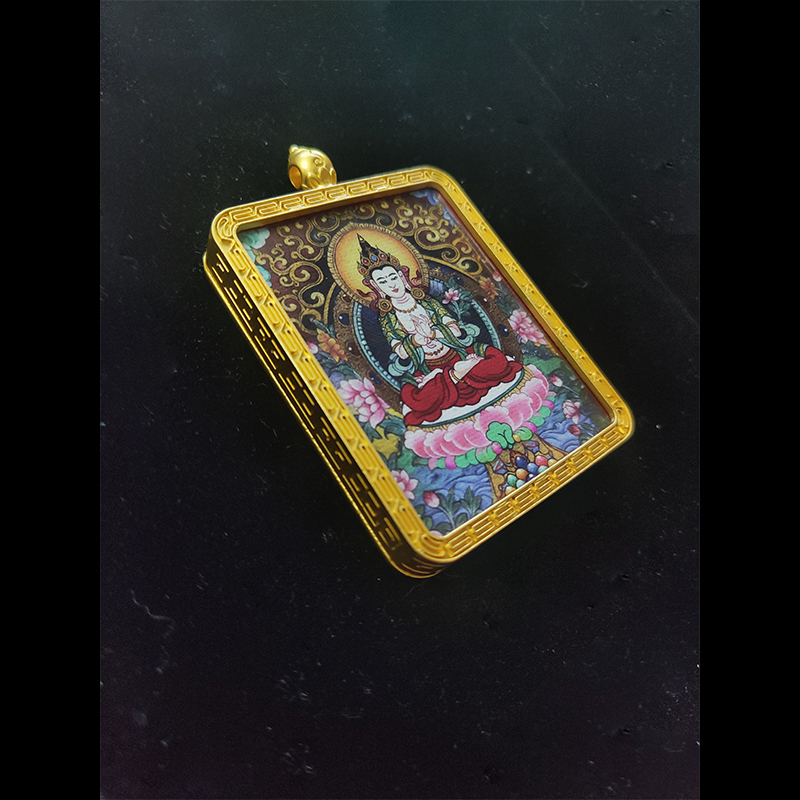 Angled view of Mahasthamaprapta Bodhisattva (Seishi Bosatsu) pendant, the zodiac guardian for Horse, featuring detailed Buddhist art in a gold-tone frame.