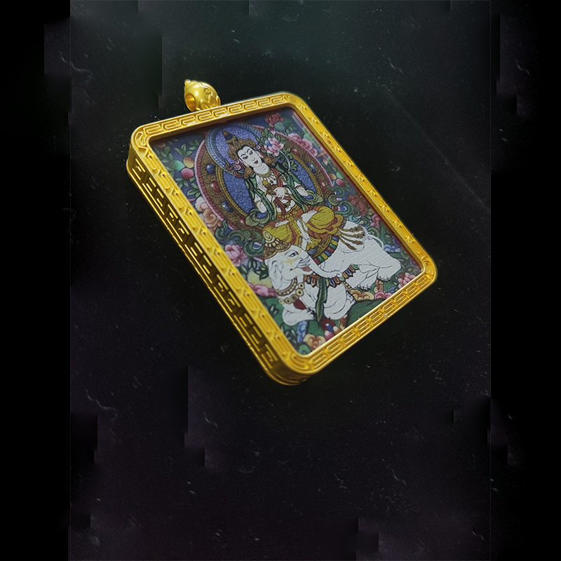 Angled high-angle view of Samantabhadra Bodhisattva (Fugen Bosatsu) pendant, the zodiac guardian for Dragon and Snake, featuring the deity on a six-tusked white elephant in a gold-tone frame.