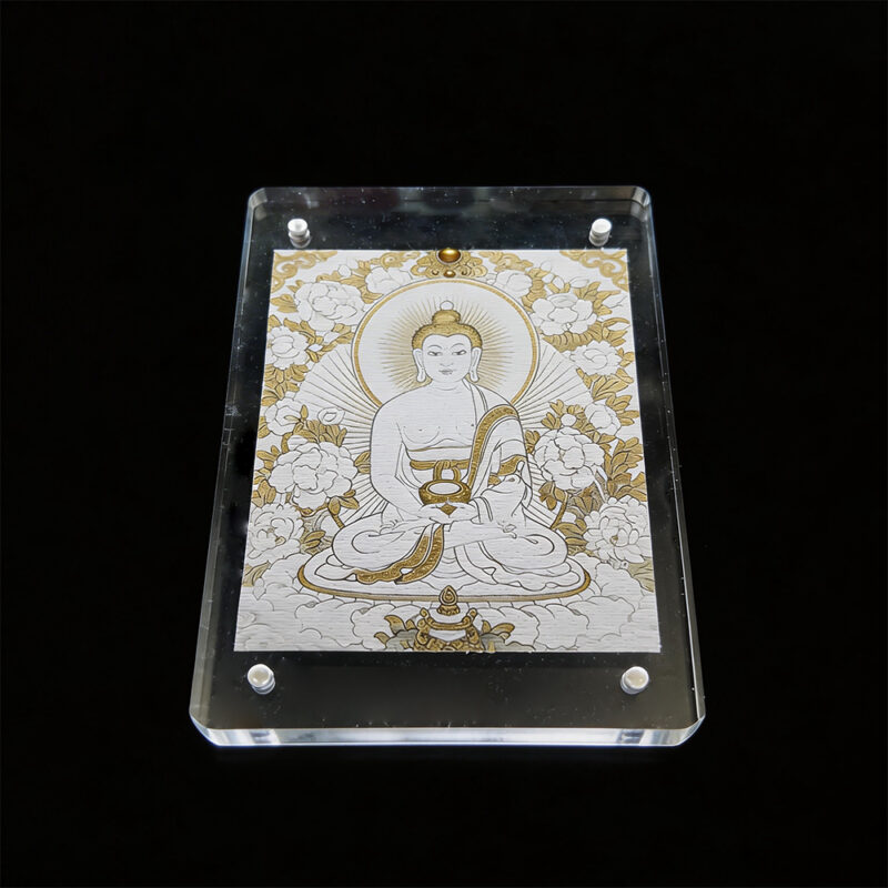 A minimalist Amitabha Buddha Thangka in an acrylic frame, featuring the "White Metal" element colors, set against a solid black background for meditation focus