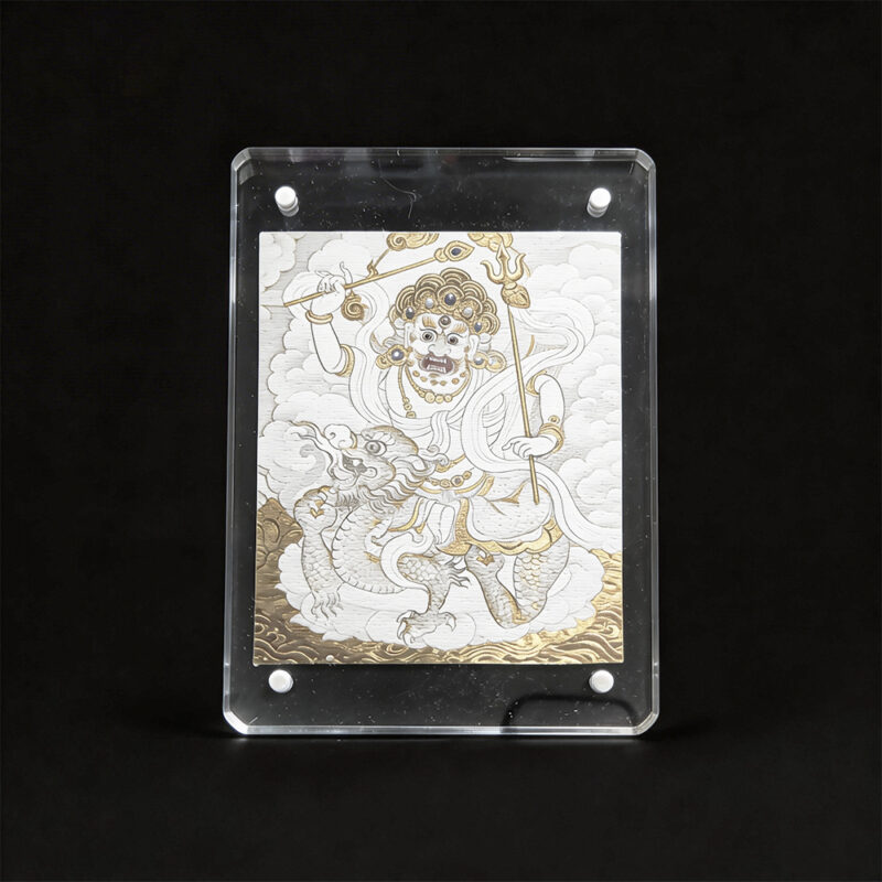 Direct front view of the White Dzambhala Buddhist art on unbleached cotton canvas, framed in a modern clear acrylic case for home protection