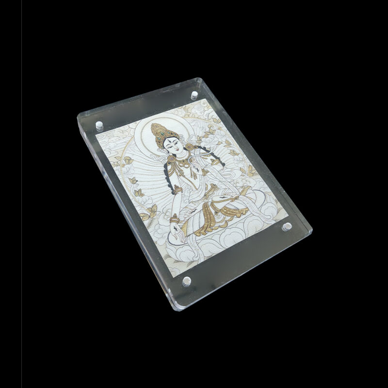 Side angled shot of the White Tara acrylic frame, highlighting the warm creamy texture of the natural canvas and the minimalist transparent frame design.