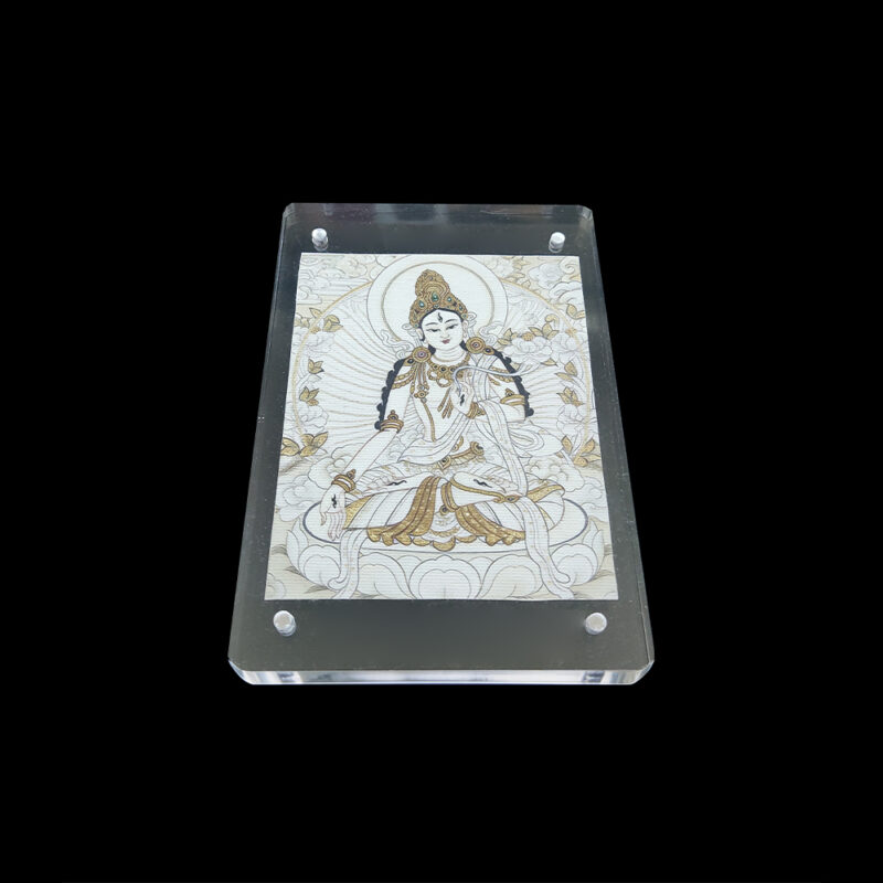Frontal view of White Tara (Saptalochana) Buddhist art on natural cotton canvas in a clear acrylic frame, symbolizing healing, longevity, and purity.