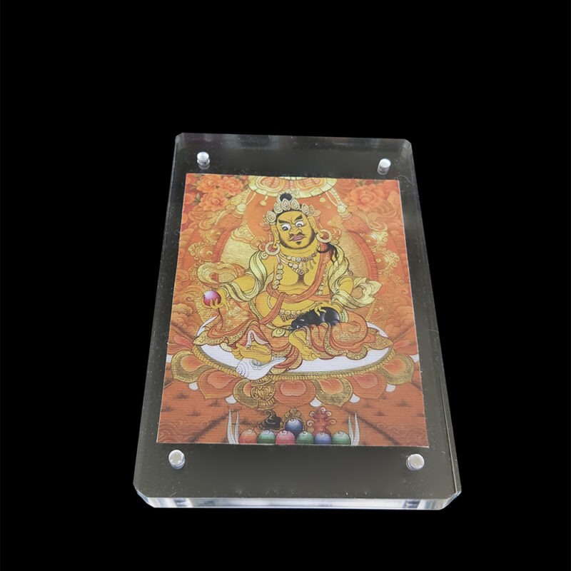Frontal view of Yellow Dzambhala (Kubera) printed on natural unbleached cotton canvas, framed in a modern acrylic case, the Buddhist deity of wealth and abundance.