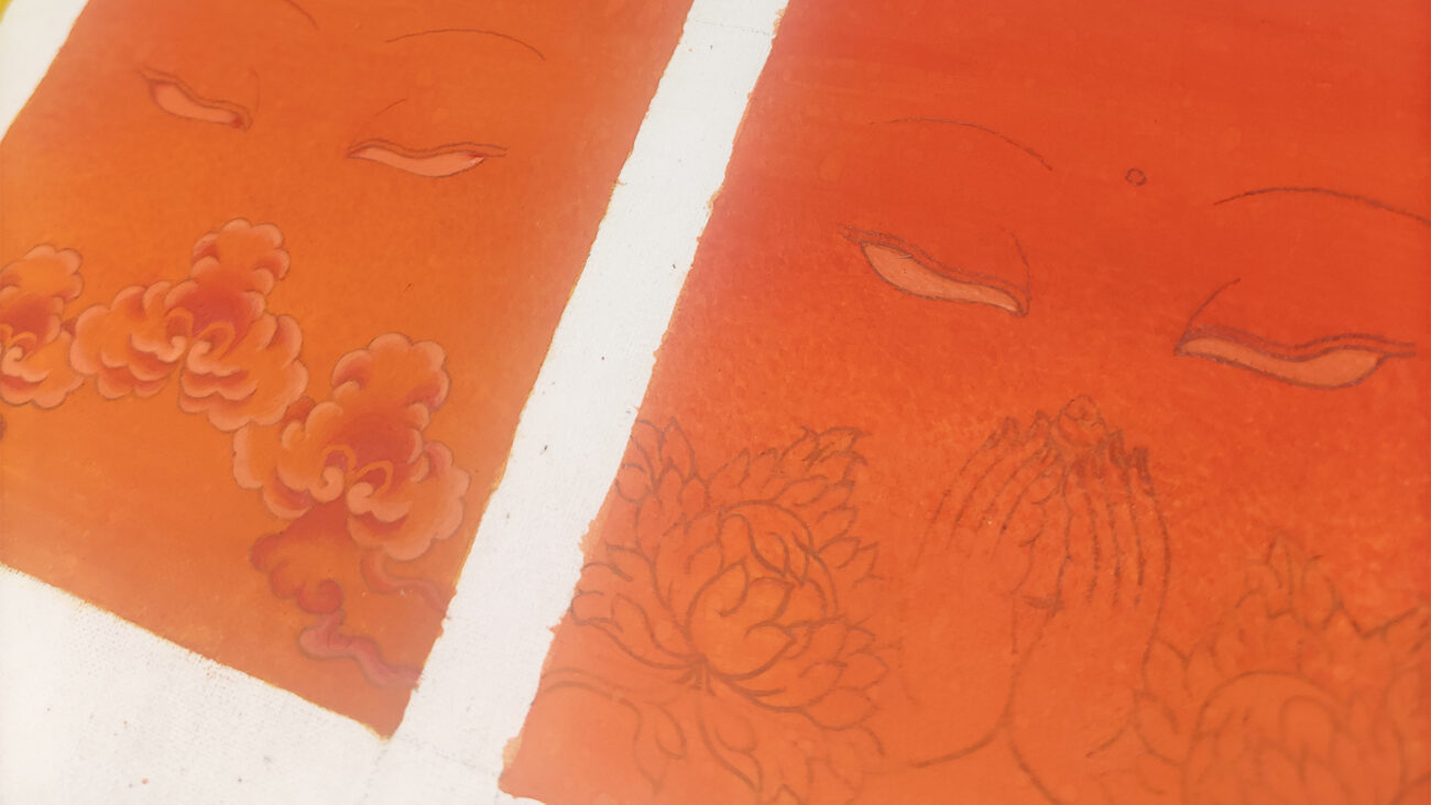 Close-up details of a hand-painted minimalist orange-red Thangka Buddha eye artwork showing intricate linework.