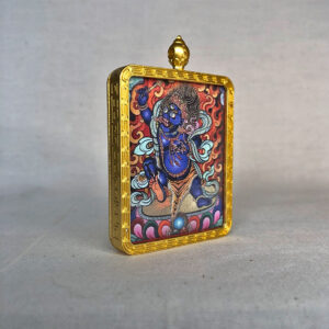 Side-angle view of blue Acala Fudo Myoo brass Gau box necklace pendant.