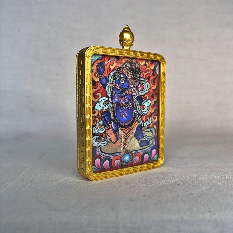 Side-angle view of blue Acala Fudo Myoo brass Gau box necklace pendant.