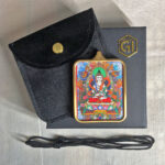 Akasagarbha Gau box necklace displayed with black cord, velvet pouch, and gift box.