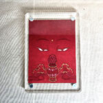 Frontal view of Amitayus Buddha Eyes acrylic block for red color meditation.