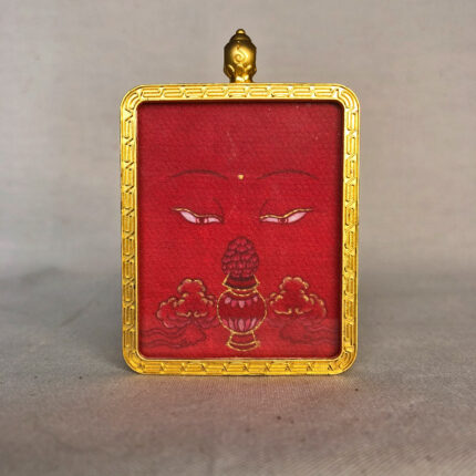 Frontal view of Amitayus Buddha Eyes pendant for Root Chakra color meditation.