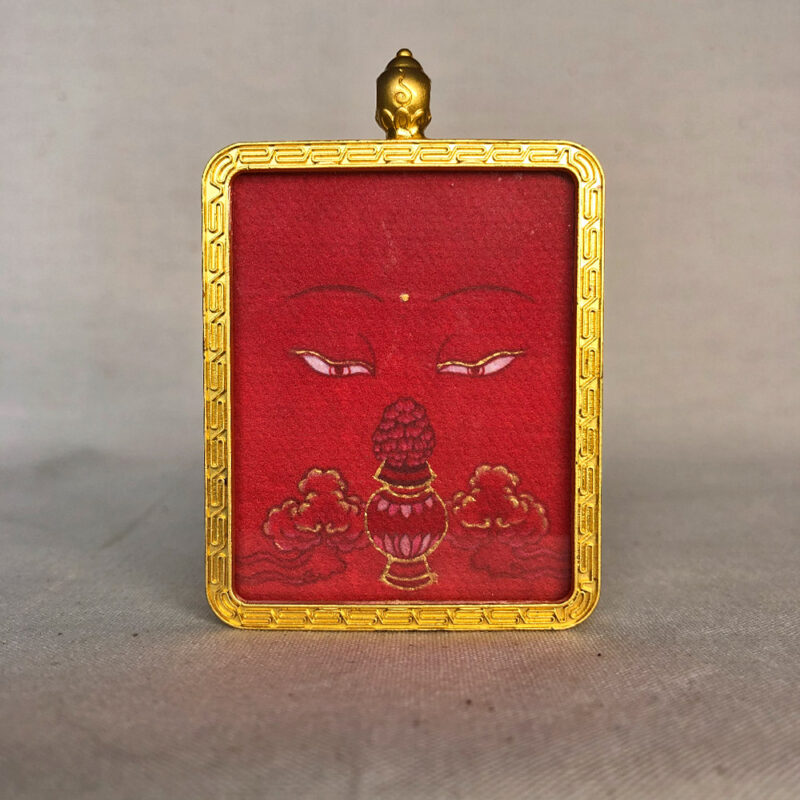 Frontal view of Amitayus Buddha Eyes pendant for Root Chakra color meditation.