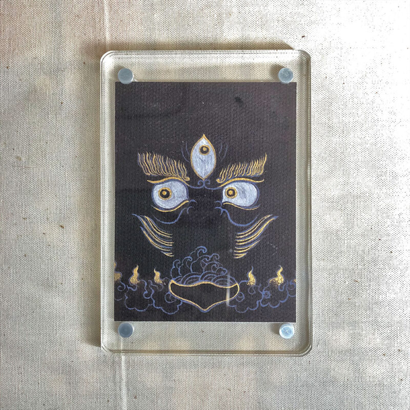 Frontal view of Black Jambhala Buddha Eyes acrylic block for black color meditation.
