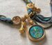 A handmade 1.5cm Buddha Eye meditation bracelet with woven cords and gold charms