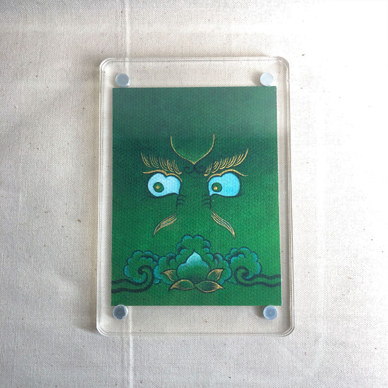 Frontal view of Green Jambhala Buddha Eyes acrylic block for green color meditation.