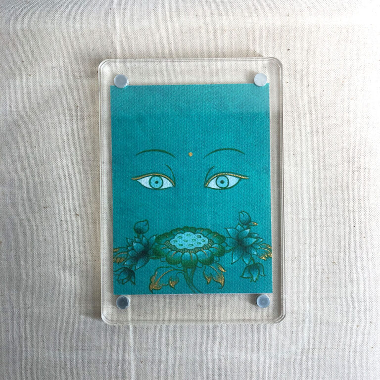 Frontal view of Green Tara Buddha Eyes acrylic block for green color meditation.