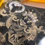 Close-up of HD giclée Black Jambhala Thangka print showing wrathful deity features and gold linework.