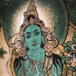 Close-up of HD giclée Green Tara Thangka print showing compassionate facial features and fine line work.