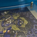 Close-up of HD giclée Indigo Black Jambhala Thangka print showing wrathful deity features and gold linework.