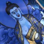 Close-up of HD giclée Medicine Buddha Thangka print showing serene lapis blue features and fine line work.