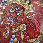 Close-up of HD giclée Red Jambhala Thangka print showing intense facial features and gold details.