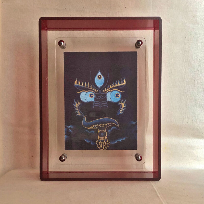 Front view of indigo Yamantaka Buddha Eyes print in a red floating translucent acrylic frame.