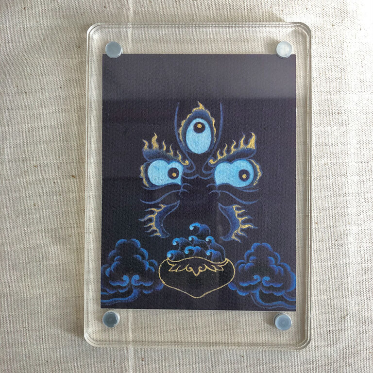 Frontal view of Mahakala Buddha Eyes acrylic block for dark blue and black color meditation.