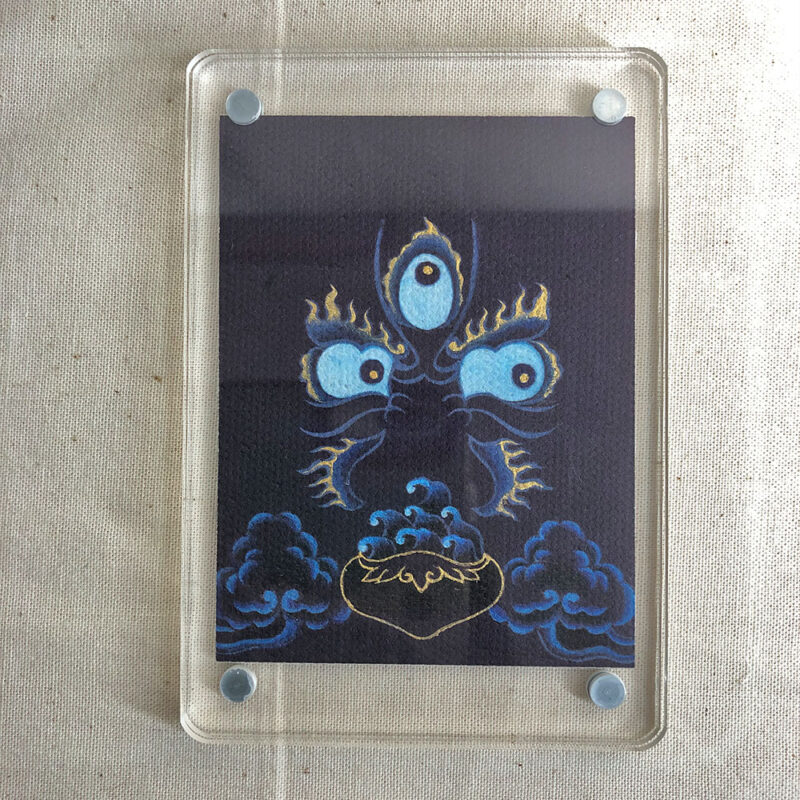 Frontal view of Mahakala Buddha Eyes acrylic block for dark blue and black color meditation.
