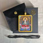 Mahasthamaprapta Gau box necklace displayed with black cord, velvet pouch, and gift box.