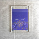 Frontal view of Mahavairocana Buddha Eyes acrylic block for purple color meditation.