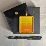 Manjushri Buddha Eyes Gau box necklace presented with cord, pouch, and gift box.