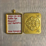 Inner view of brass Gau box featuring artist signature card and custom backplate.