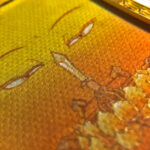 Macro detail of hand-painted gold linework on Manjushri Buddha Eyes yellow fine art canvas.