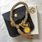 Manjushri Buddha Eyes yellow bracelet presented with velvet pouch and Golden Ink Arts box.