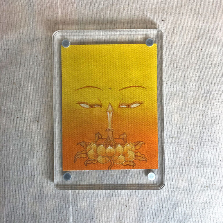 Frontal view of Manjushri Buddha Eyes acrylic block for yellow color meditation.