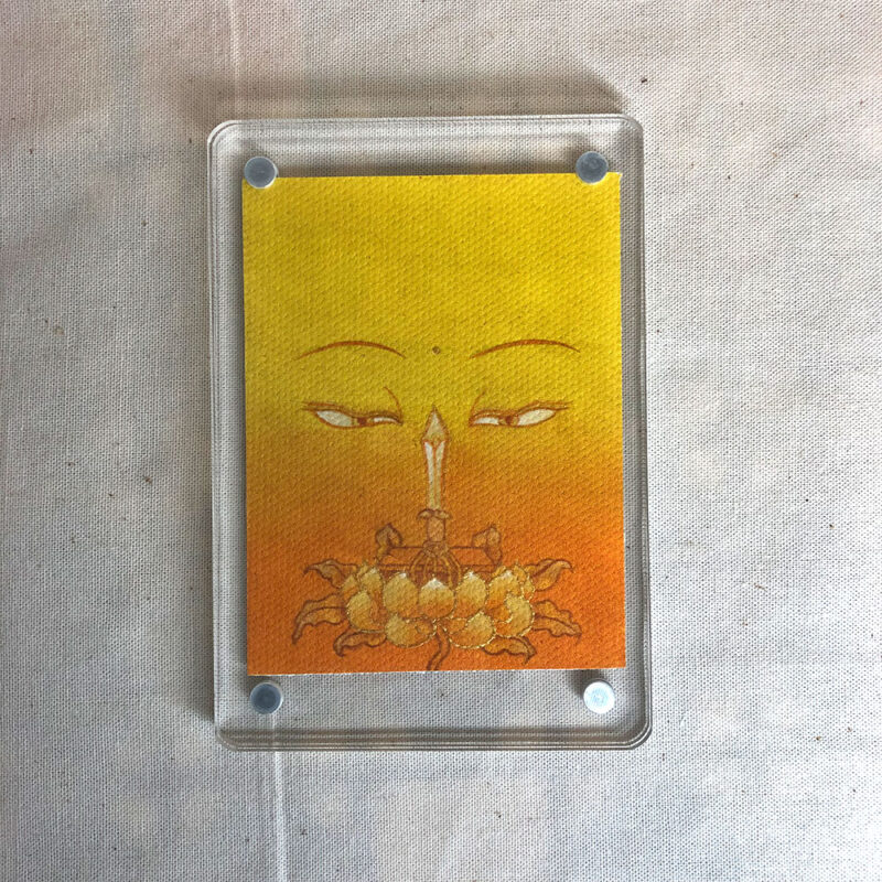 Frontal view of Manjushri Buddha Eyes acrylic block for yellow color meditation.