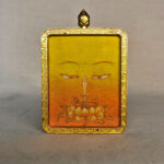 Frontal view of Manjushri Buddha Eyes pendant for Solar Plexus Chakra color meditation.