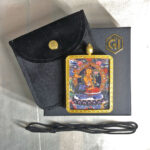 Manjushri Gau box necklace displayed with black cord, velvet pouch, and gift box.