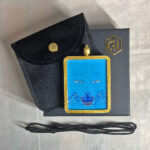 Medicine Buddha Eyes Gau box necklace presented with cord, pouch, and gift box.