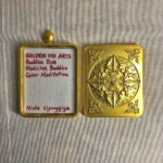 Inner view of brass Gau box featuring artist signature card and custom backplate.