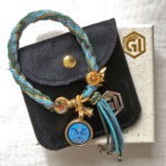 Medicine Buddha Eyes blue bracelet presented with velvet pouch and Golden Ink Arts box.