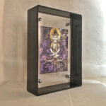 45-degree side view of modern clear acrylic thangka desktop display block.