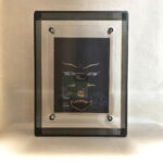 Front view of Padmasambhava Buddha Eyes print in a black floating translucent acrylic frame.