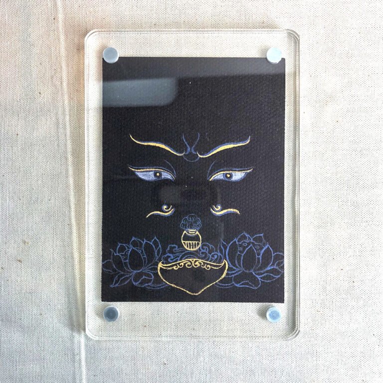 Frontal view of Padmasambhava Buddha Eyes acrylic block for black color meditation.