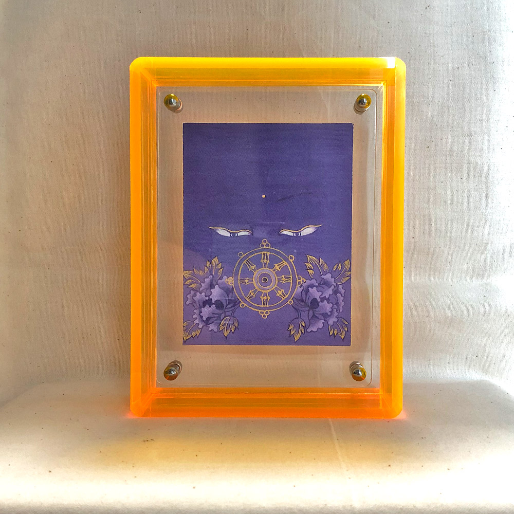 purple-buddha-eyes-art-yellow-acrylic-frame-front Front view of purple Vairochana Buddha Eyes print in a yellow floating translucent acrylic frame.
