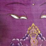 Close-up of original hand-painted gold Vajra linework and wisdom Buddha eyes on purple canvas.