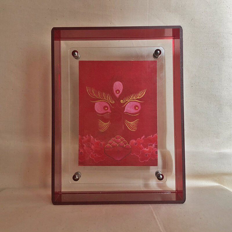 Front view of red Jambhala Buddha Eyes print in a red floating translucent acrylic frame.